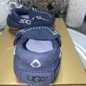 Authentic UGG infant slipper, never worn